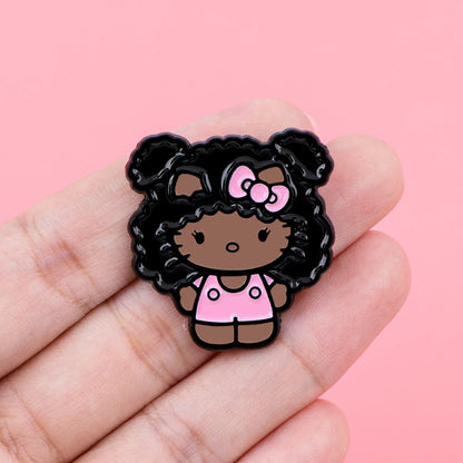 Enamel pin held in hand for scale