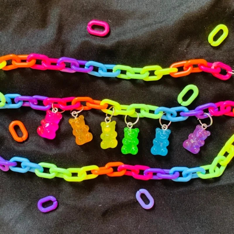 Rainbow bear chain necklace flat lay