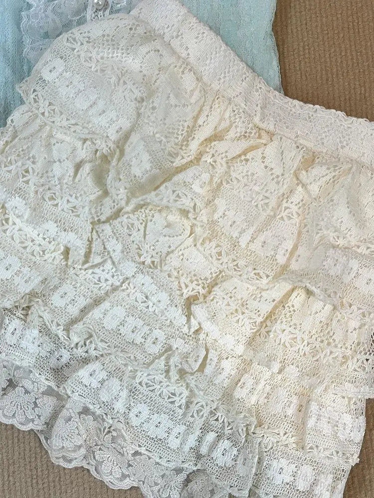 Tiered antique cream lace ruffle detail on the mini skirt