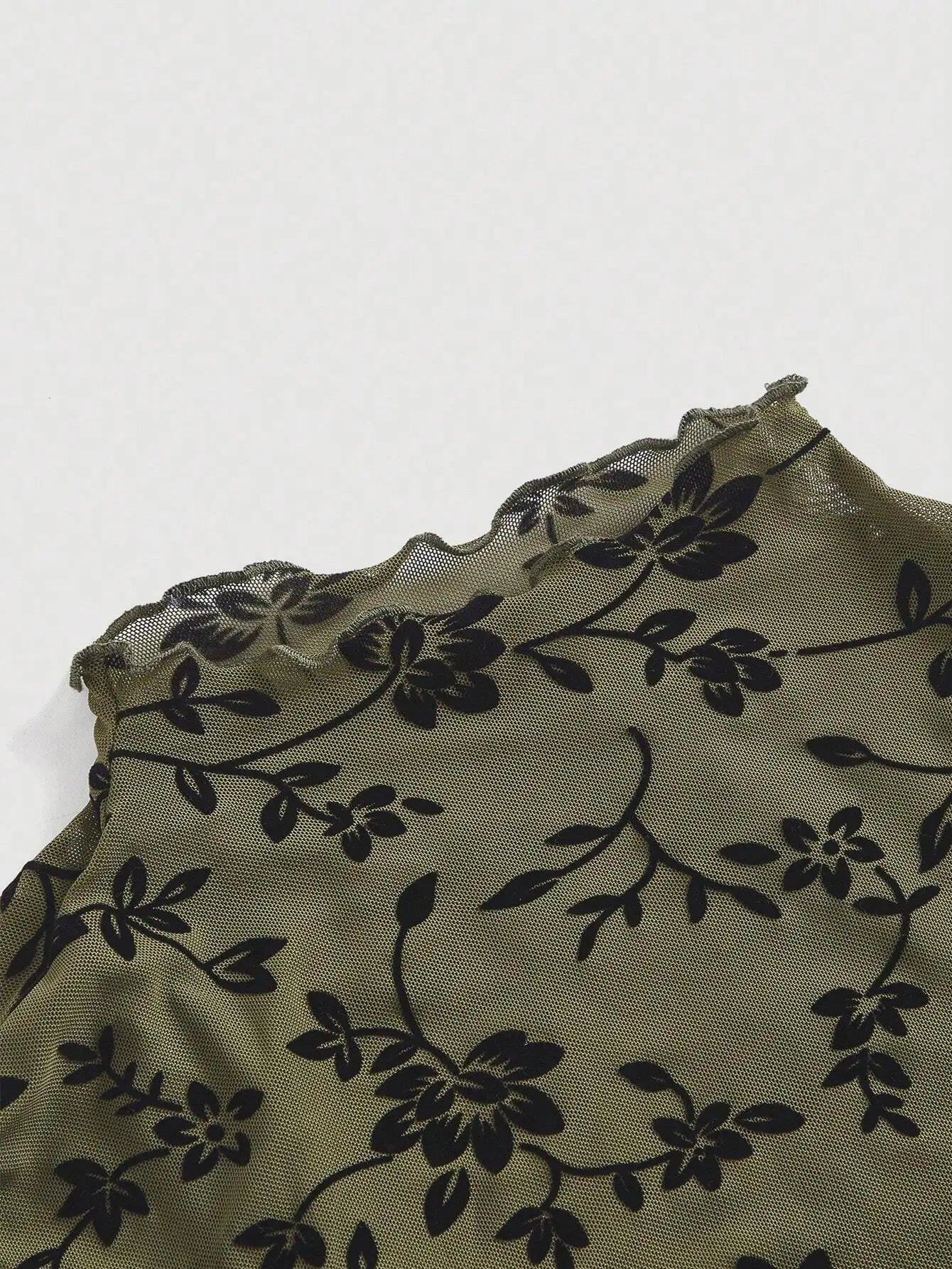 Ruffled sleeve and hem detail