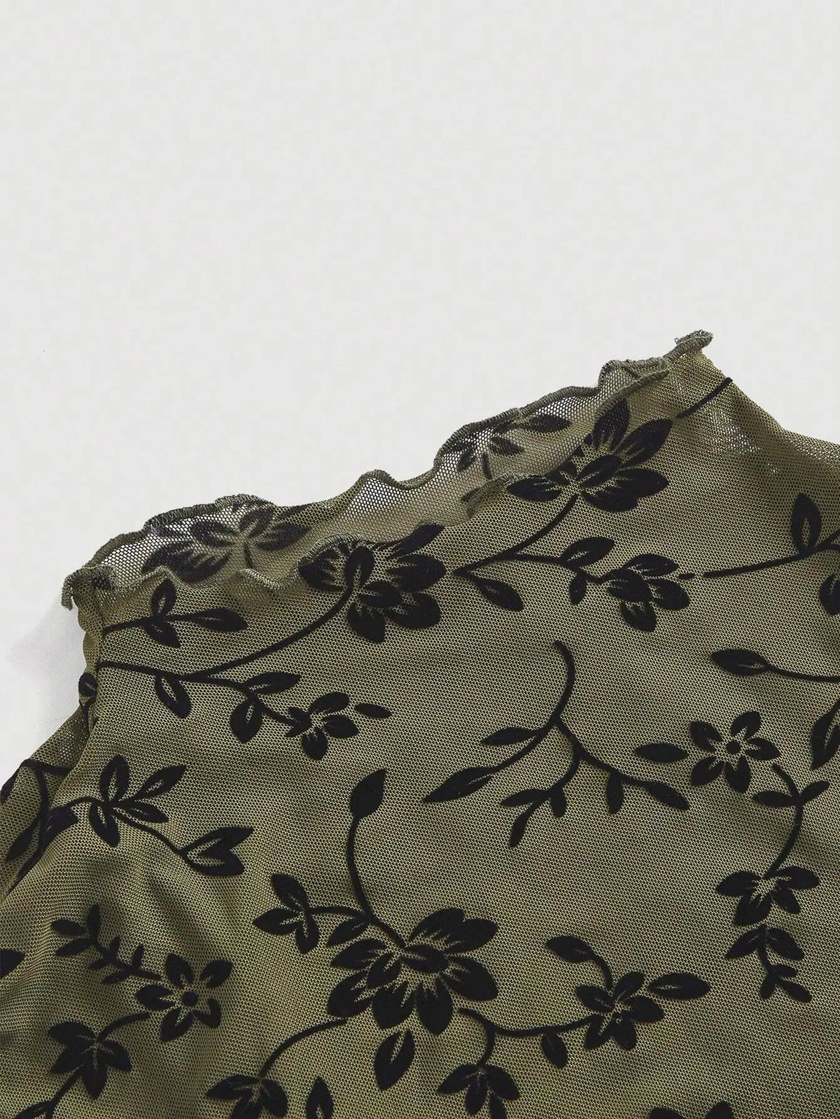 Ruffled sleeve and hem detail