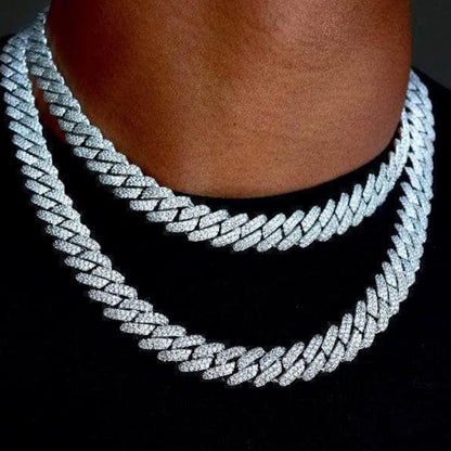 Iced two-row Cuban link chain worn layered at the neck