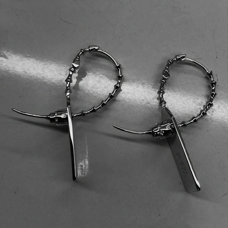 Pair of buzzsaw cyber drop earrings