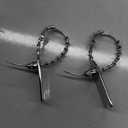 Pair of buzzsaw cyber drop earrings