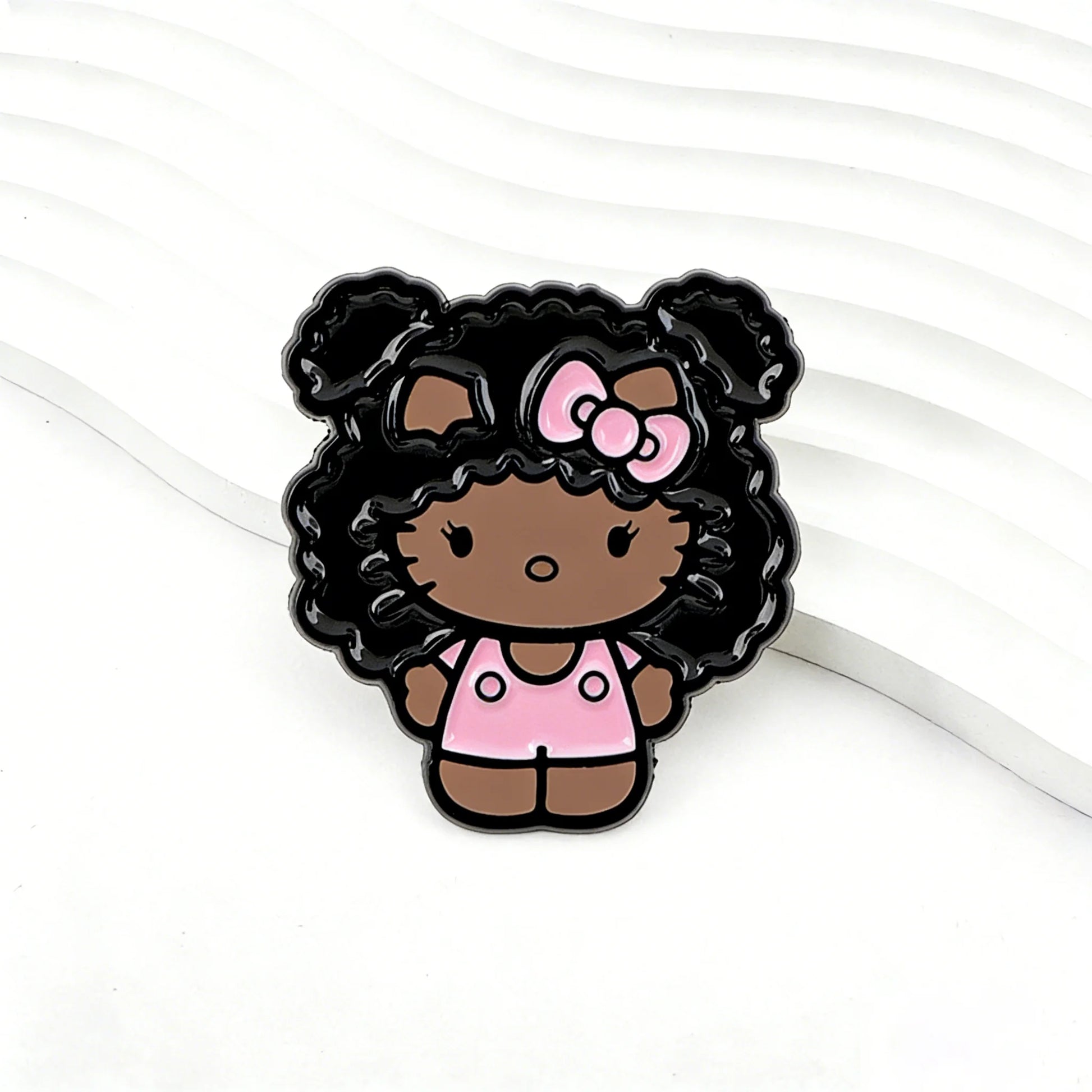 Kawaii kitty enamel pin with black curly hair and pink bow