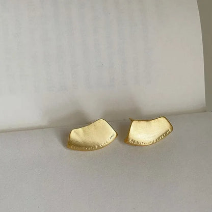 Brushed gold stud earrings pair