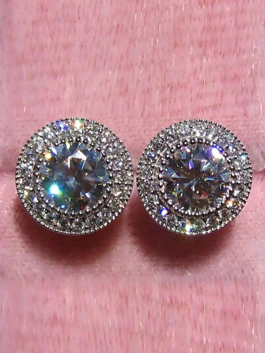 Crystal halo stud earrings on a soft pink background