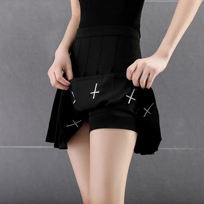 Close view of pleats and cross embroidery
