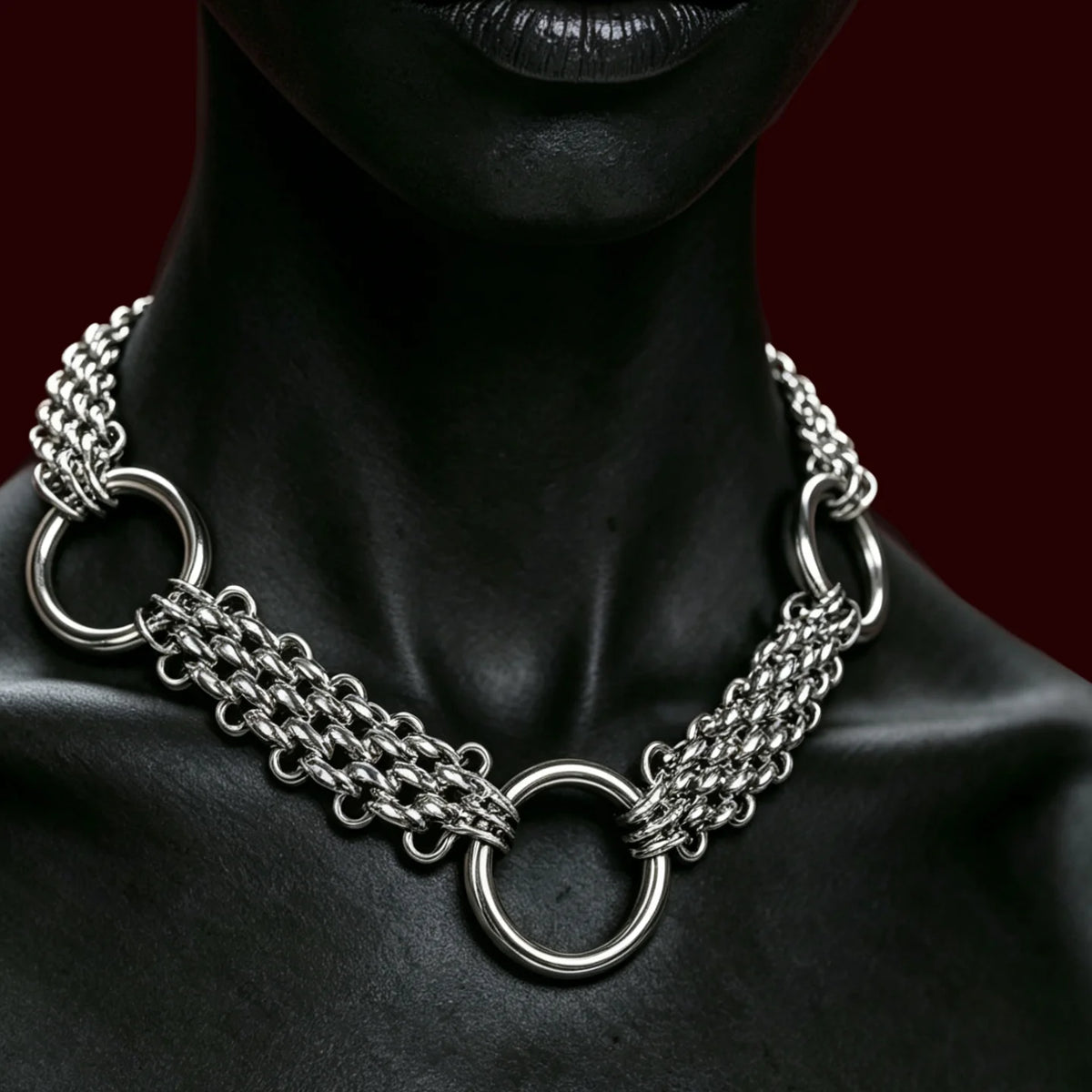 Triple-row chainmail choker with three O-rings worn at the throat