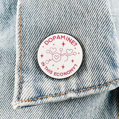 Enamel pin worn on a denim jacket pocket