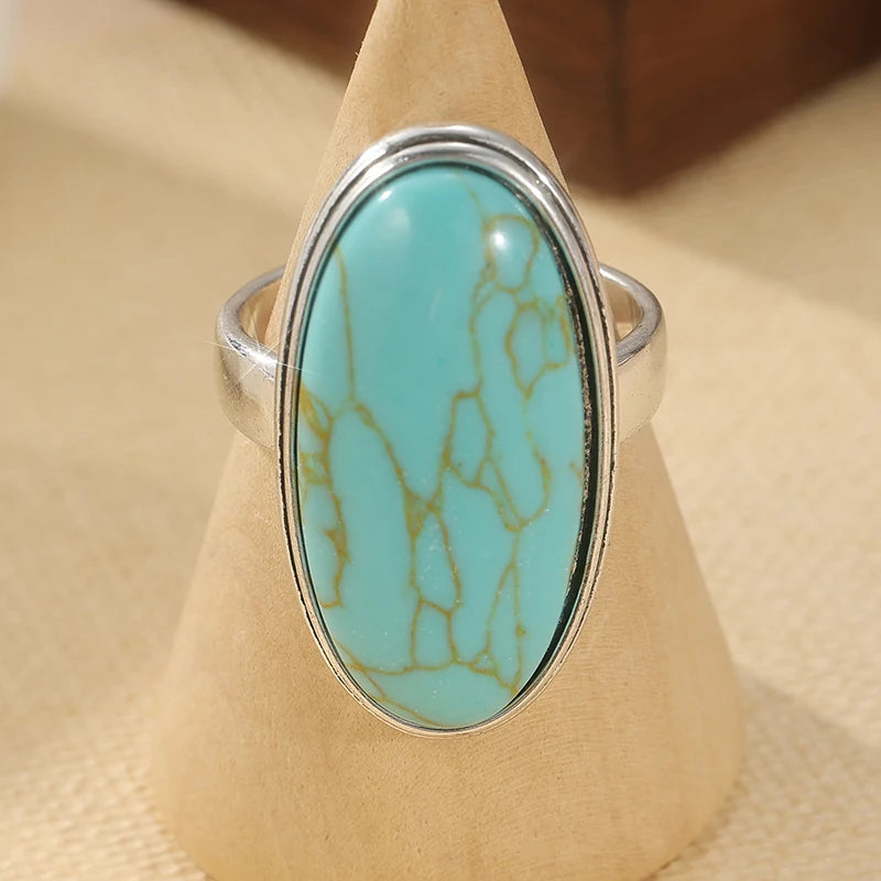 Faux turquoise oval ring displayed upright