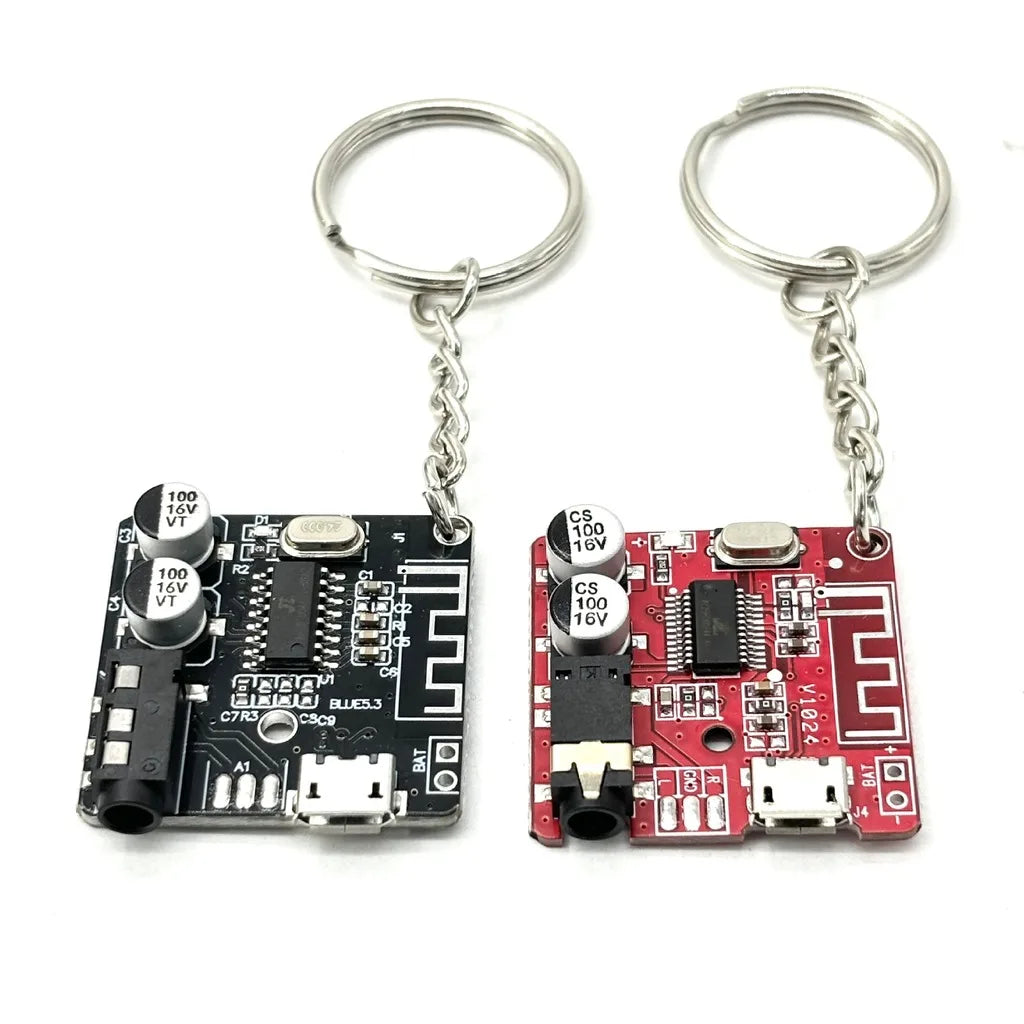 Circuit board keychains black and red side by side