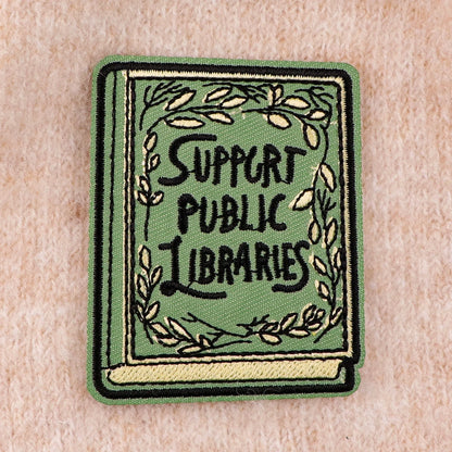 Support Public Libraries patch on soft pink knit