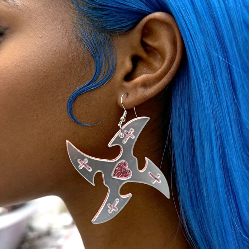 Mirror star earring worn with blue hair
