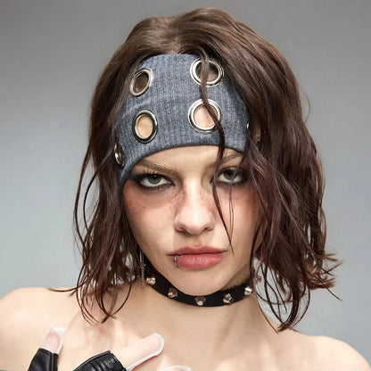Model in gray grommet headband on a gray studio backdrop