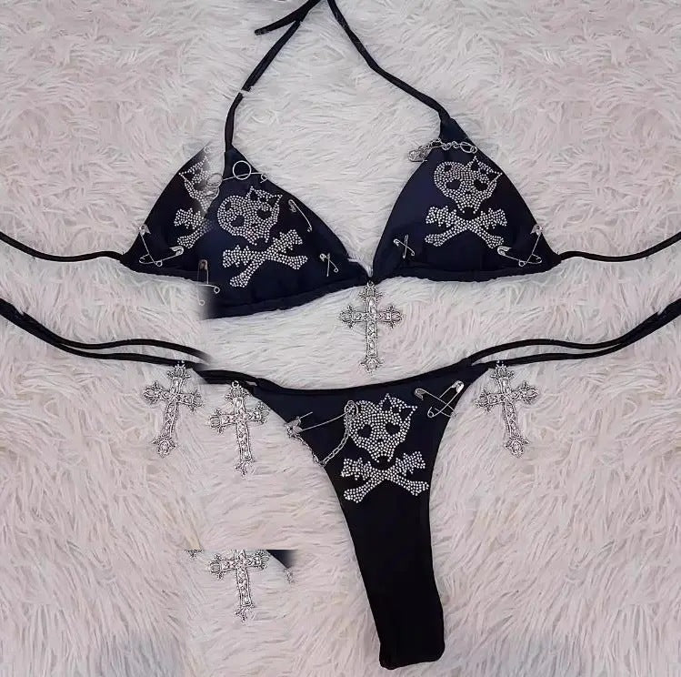 Crossbones skull rhinestone bikini set laid flat