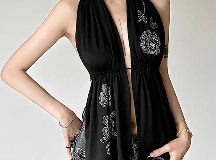 Black halter top with white rose print and open draped front panels