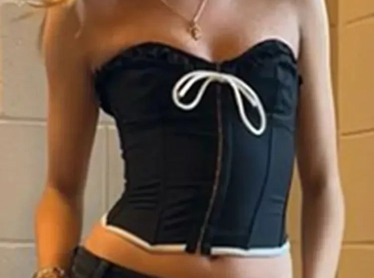 Black satin strapless bustier with ivory ribbon bow down the front