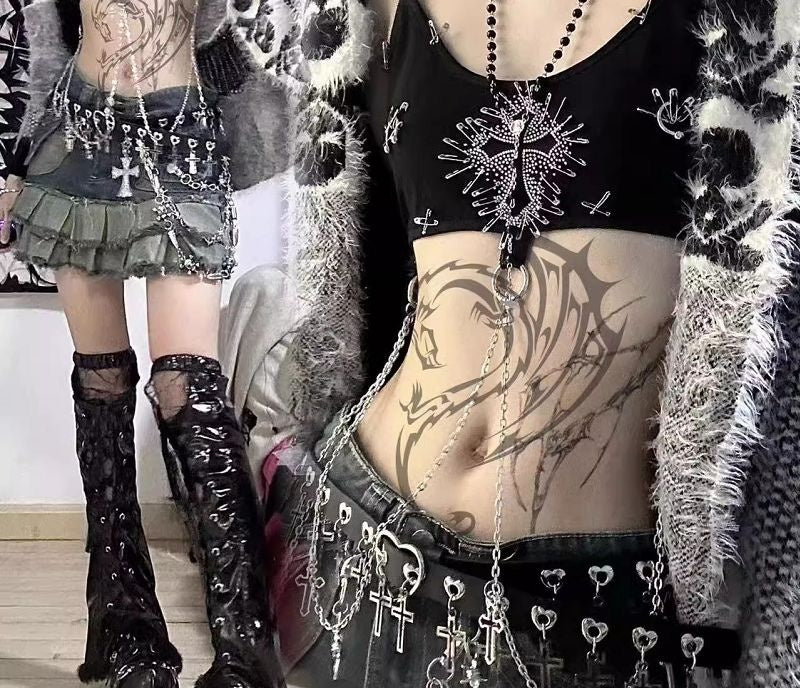 Studded cami and charm harness styled with a pleated skirt