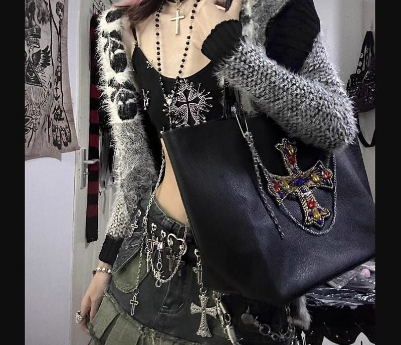 Charm harness detail worn with a shoulder bag