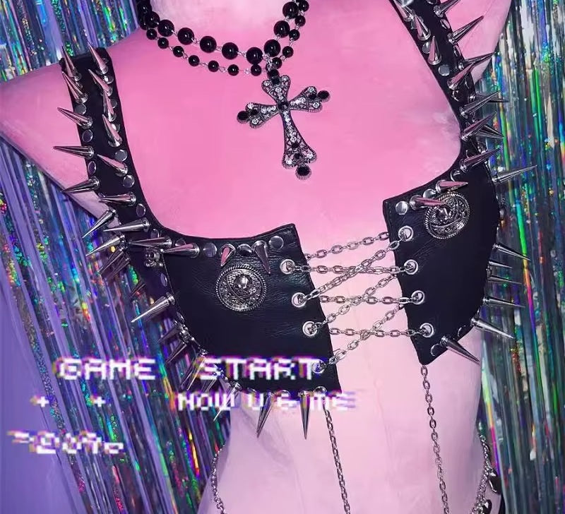 Close up of spike trim and medallion charms