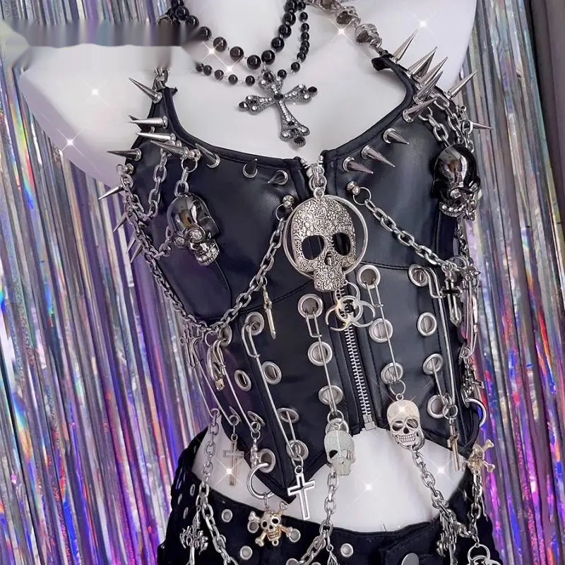 Spiked vegan leather corset top shown front-on against a metallic fringe backdrop