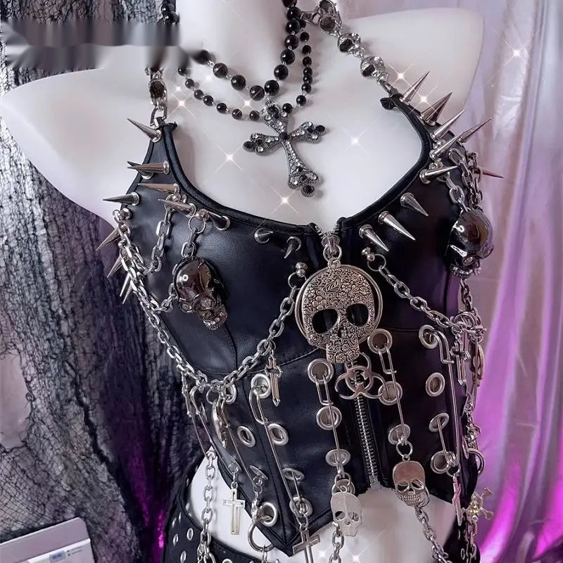 Close detail of the chain curtain, cross charms and skull beads on the corset top