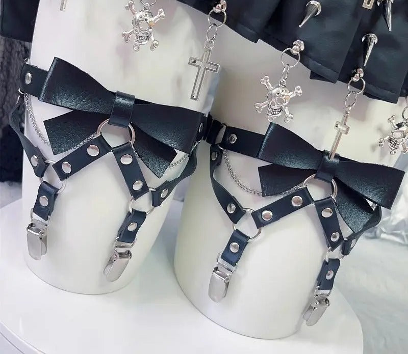 Bow front thigh garter with silver rivets and suspender clips, worn