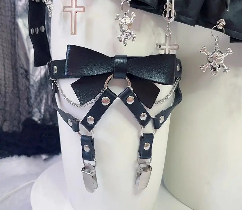 Close view of the sculpted vegan leather bow and O-ring hardware