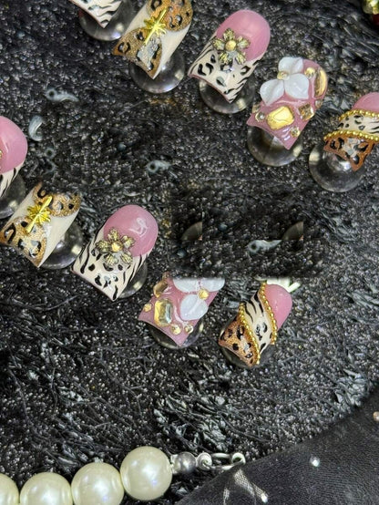 Champagne Safari press-on nails, overhead detail of the pearl flower accent nail
