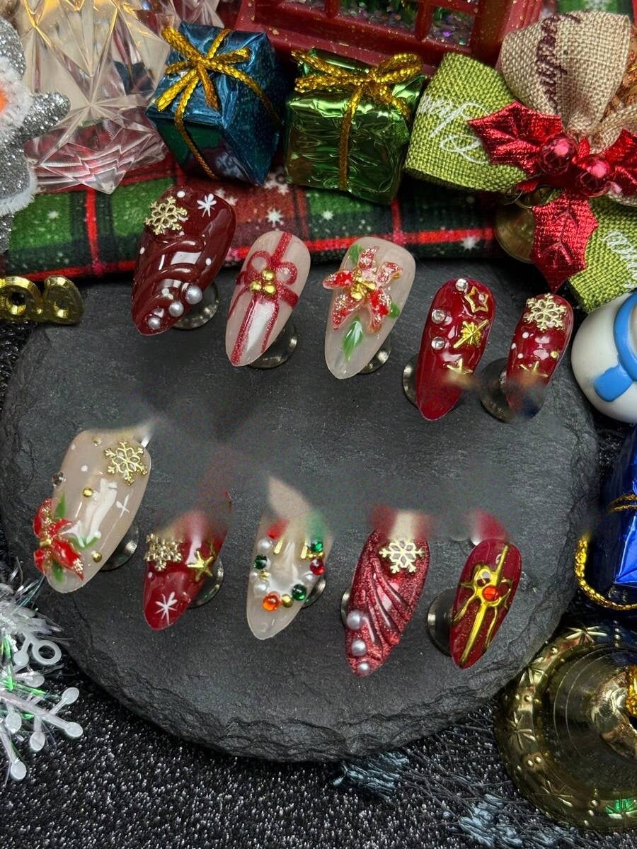 Full ten piece Christmas press-on nail set in deep red and frosted nude