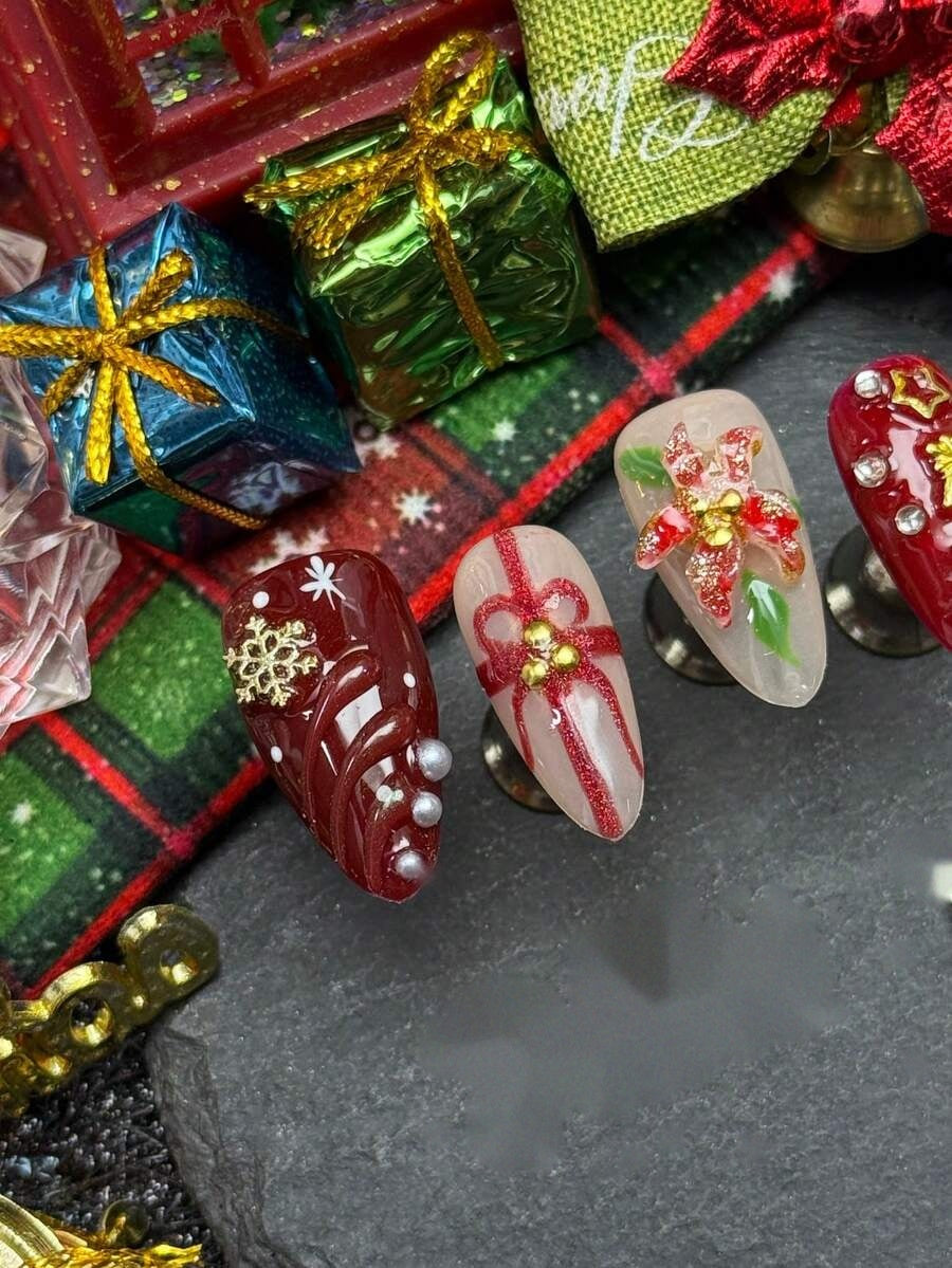 Angled view of the red poinsettia and pearl accent nails