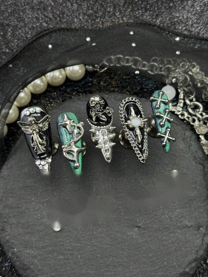 Detail of the silver angel, spike and chain nail hardware