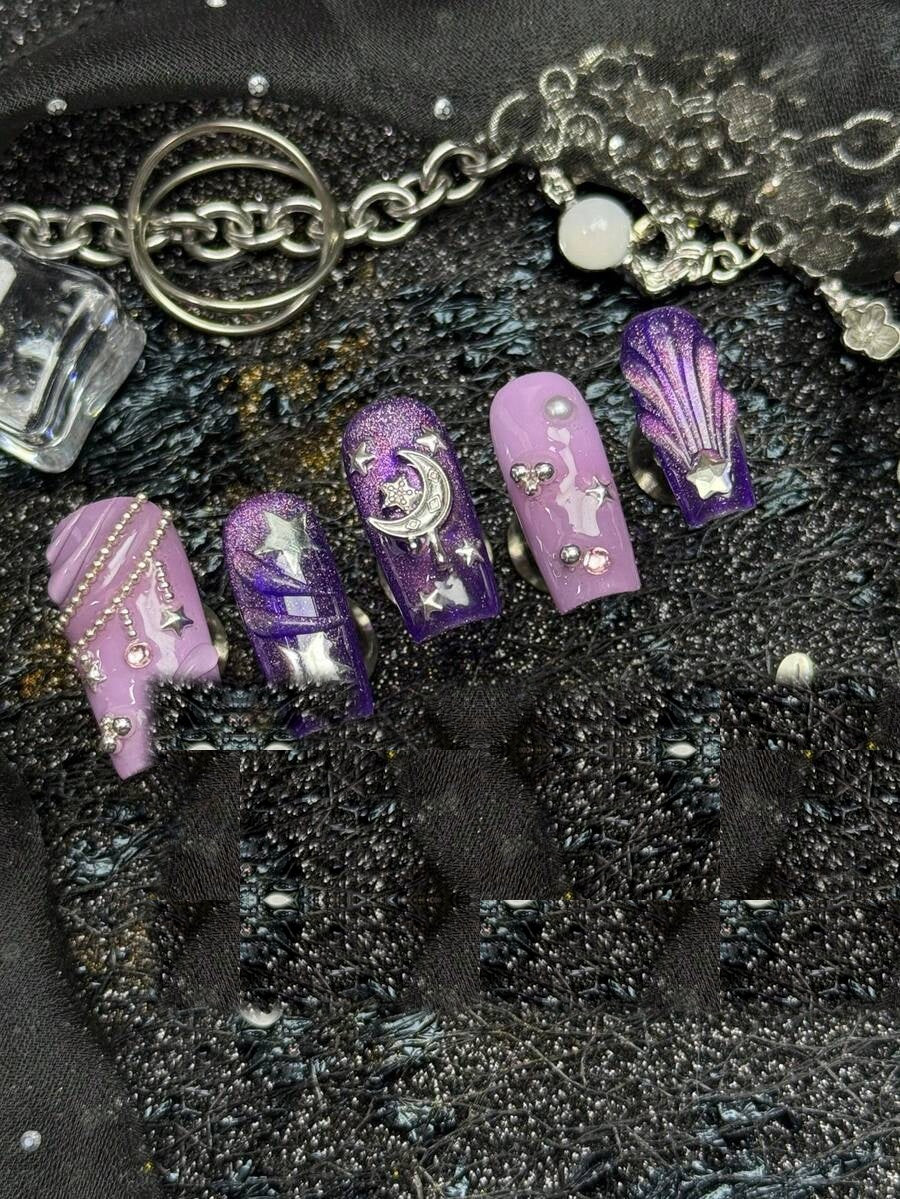 Close view of the violet cat-eye shimmer and crescent moon charms