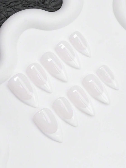 Full set of milky French almond press-on nails laid out by finger