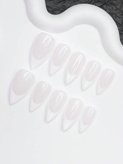 Close view of the white French tips and glossy milky pink almond nails