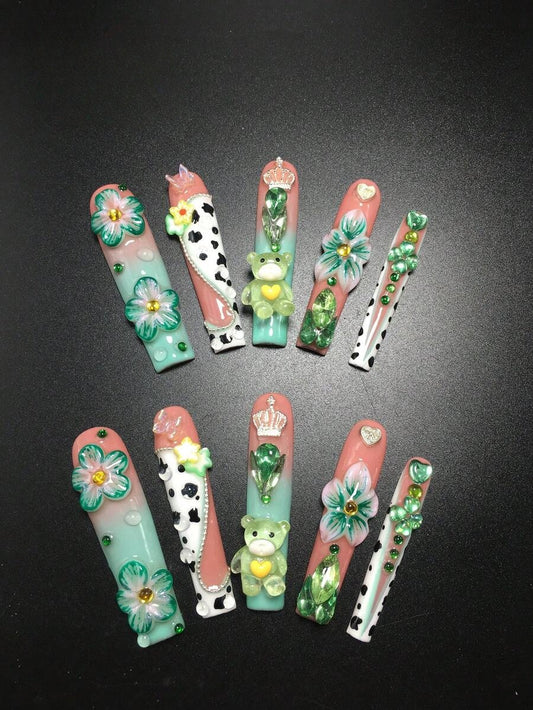 Extra long coffin press-on nails in mint and peach with cow print, 3D flowers and a green teddy bear