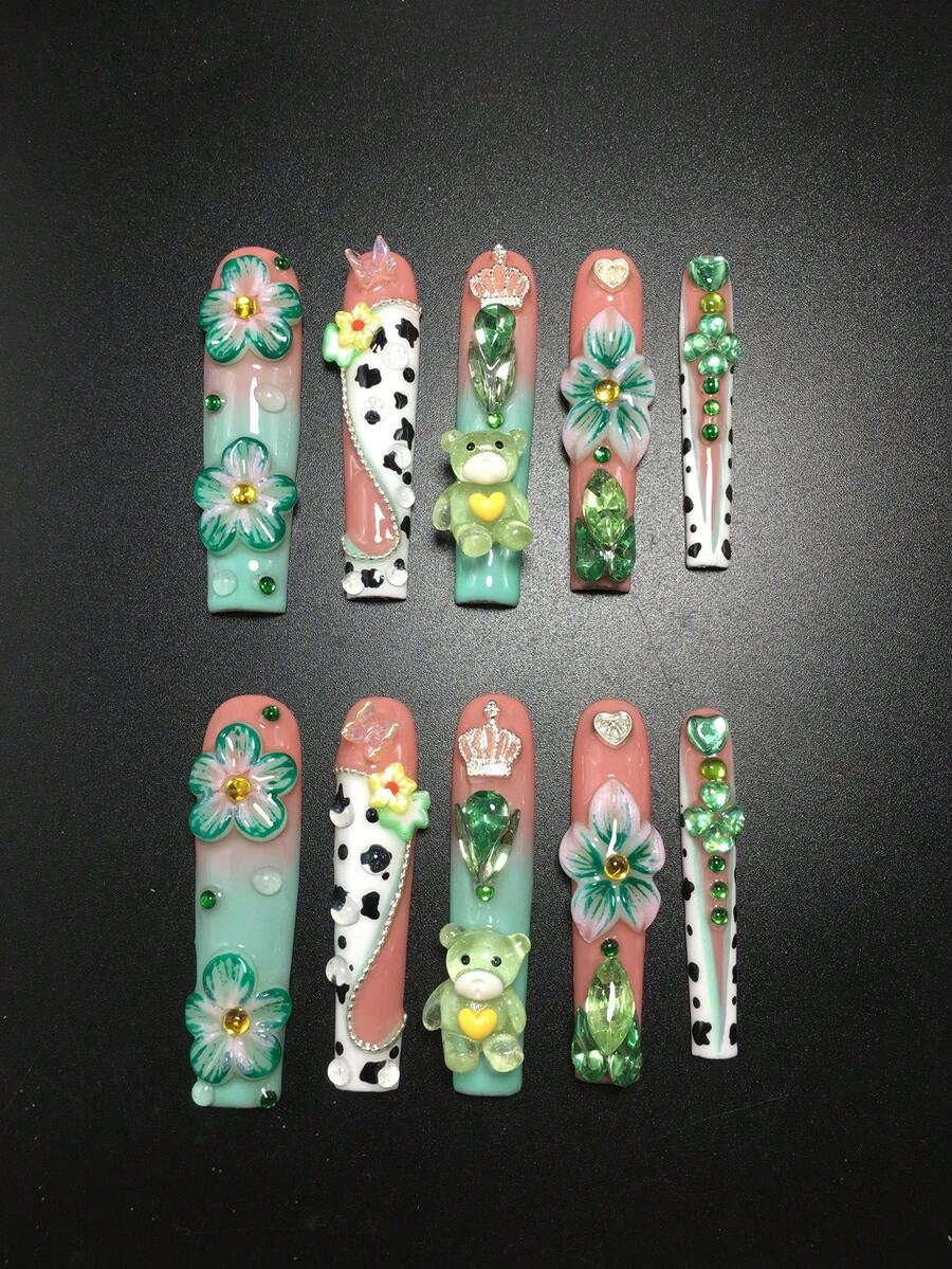 Full set of mint cow print press-on nails with teddy bear and crown charms