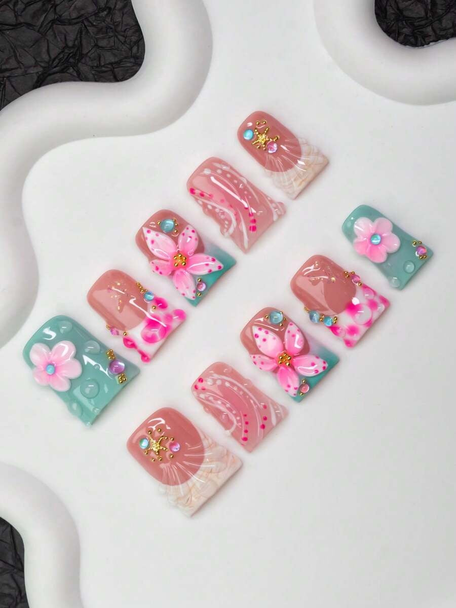Short duck flare press-on nails in mint and blush with 3D flowers and starfish charms