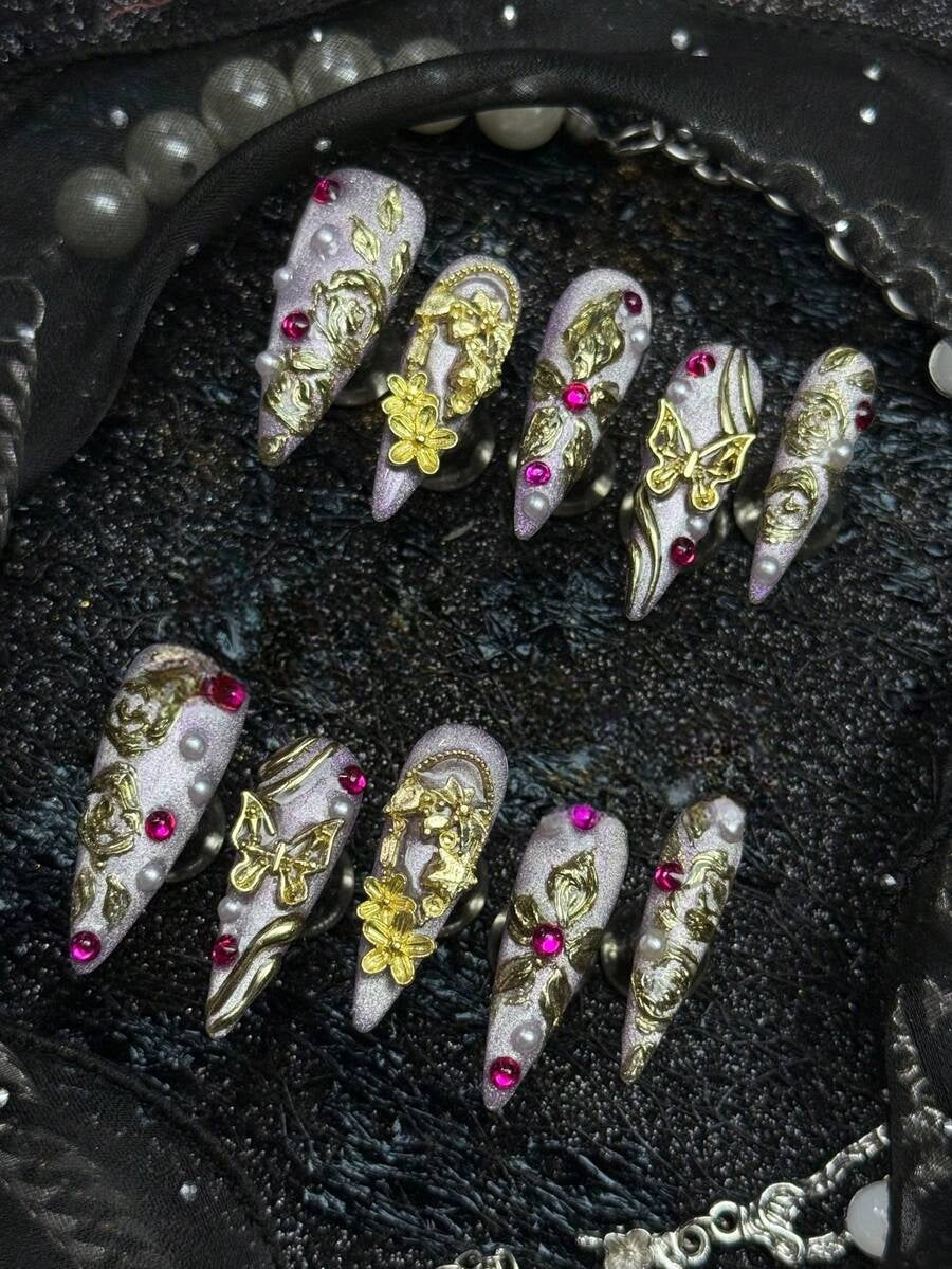 Gold floral, pearl and pink crystal detail on lilac stiletto nails