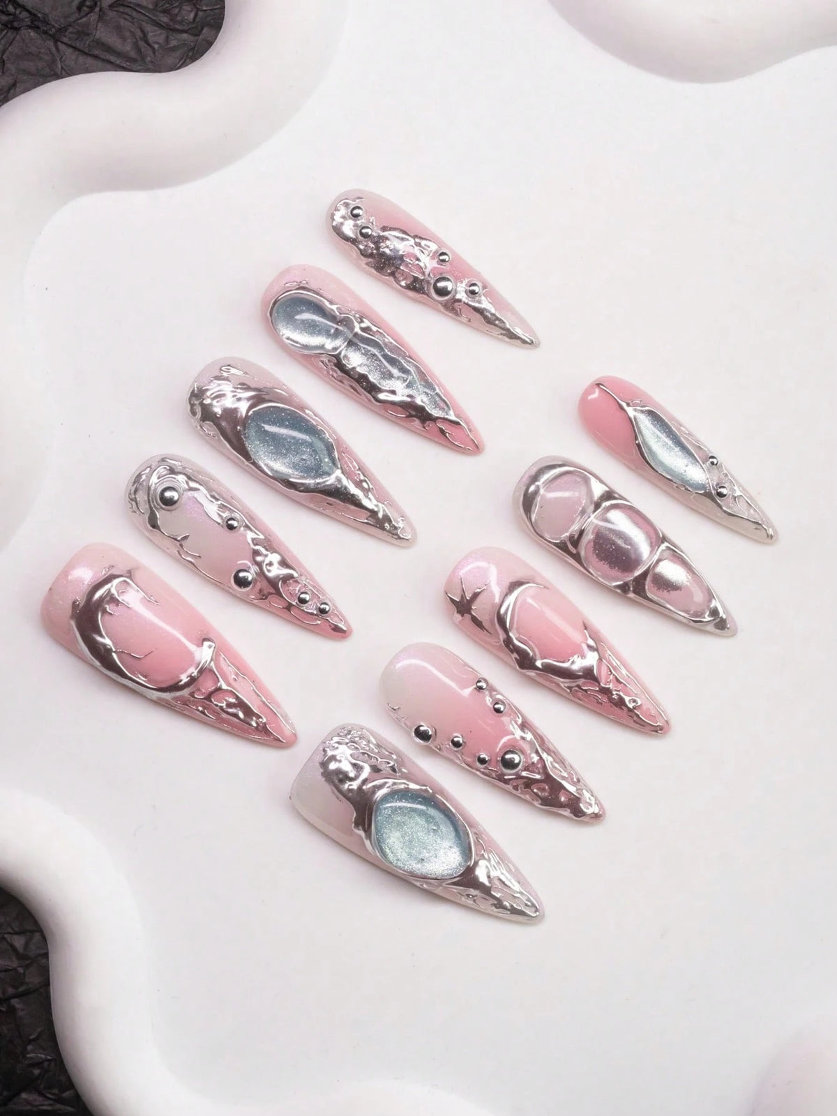 Chrome Rose press-on nails with blue moon gems