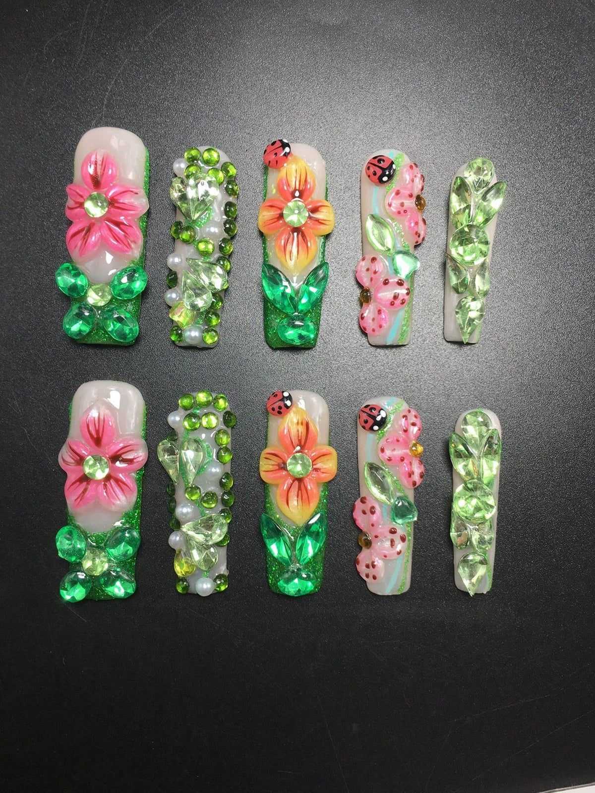 Garden Party press-on nails with pink hibiscus and ladybugs