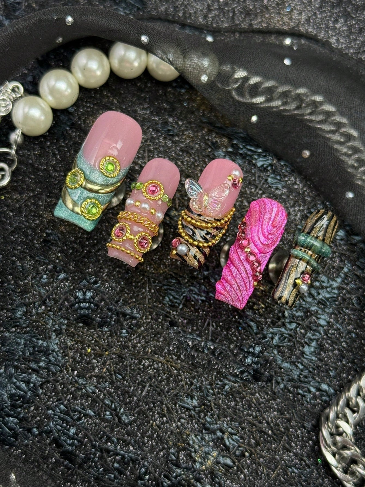 Mint and hot pink long square press-on nails with gold chains and butterfly