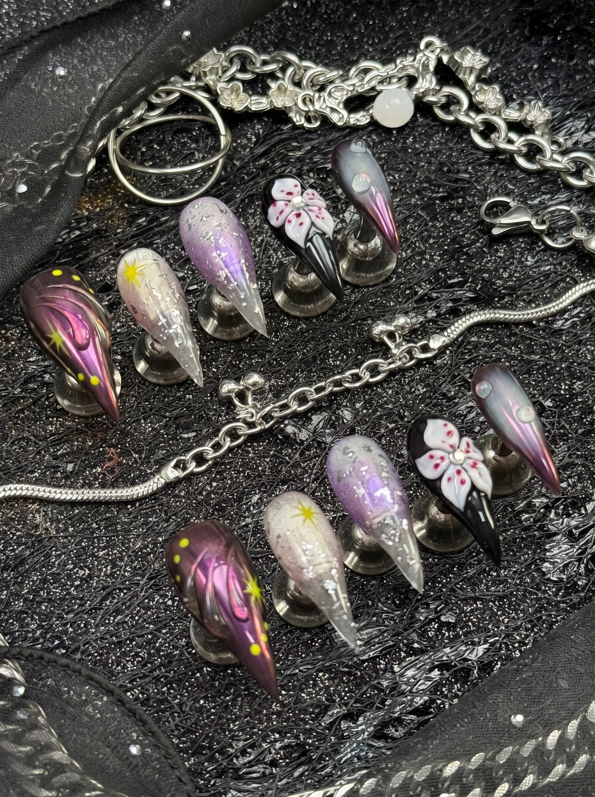 Dark floral stiletto press-on nail set with neon star accents