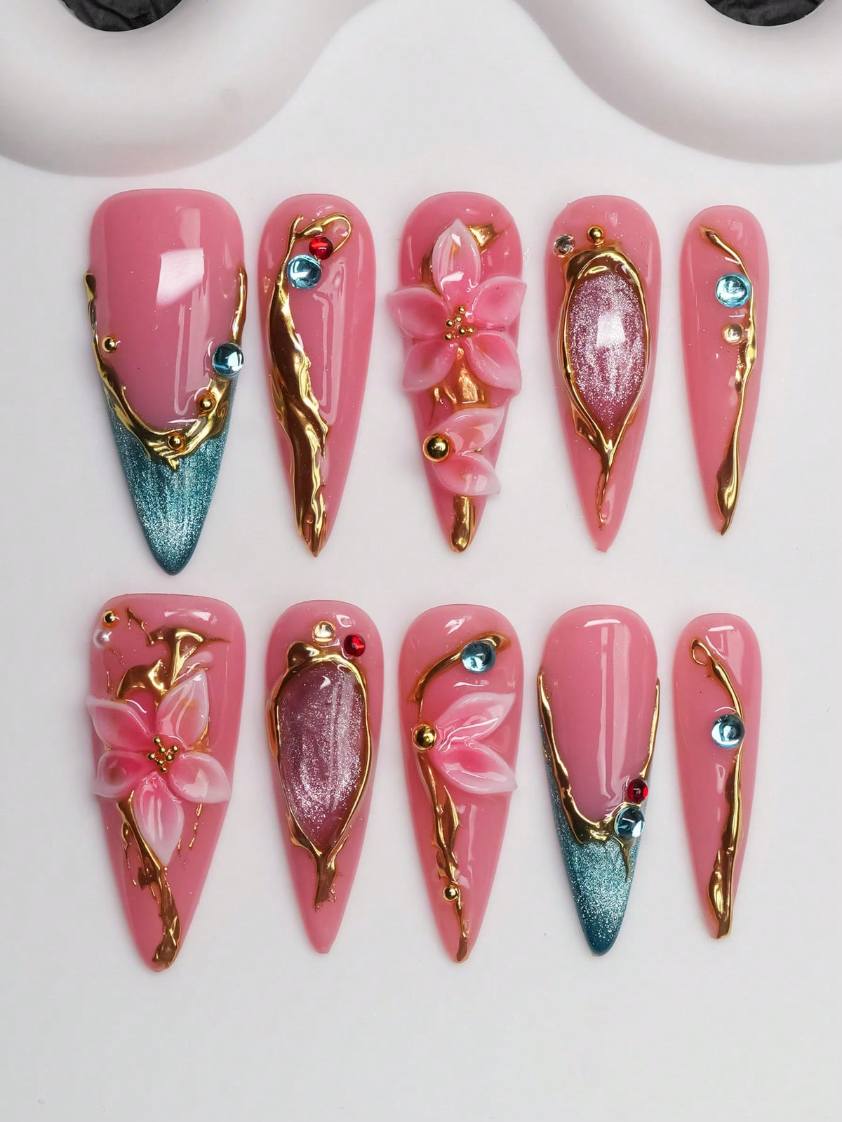 Gilded Lily long stiletto press on nails, pink gel with gold and teal cat-eye tips