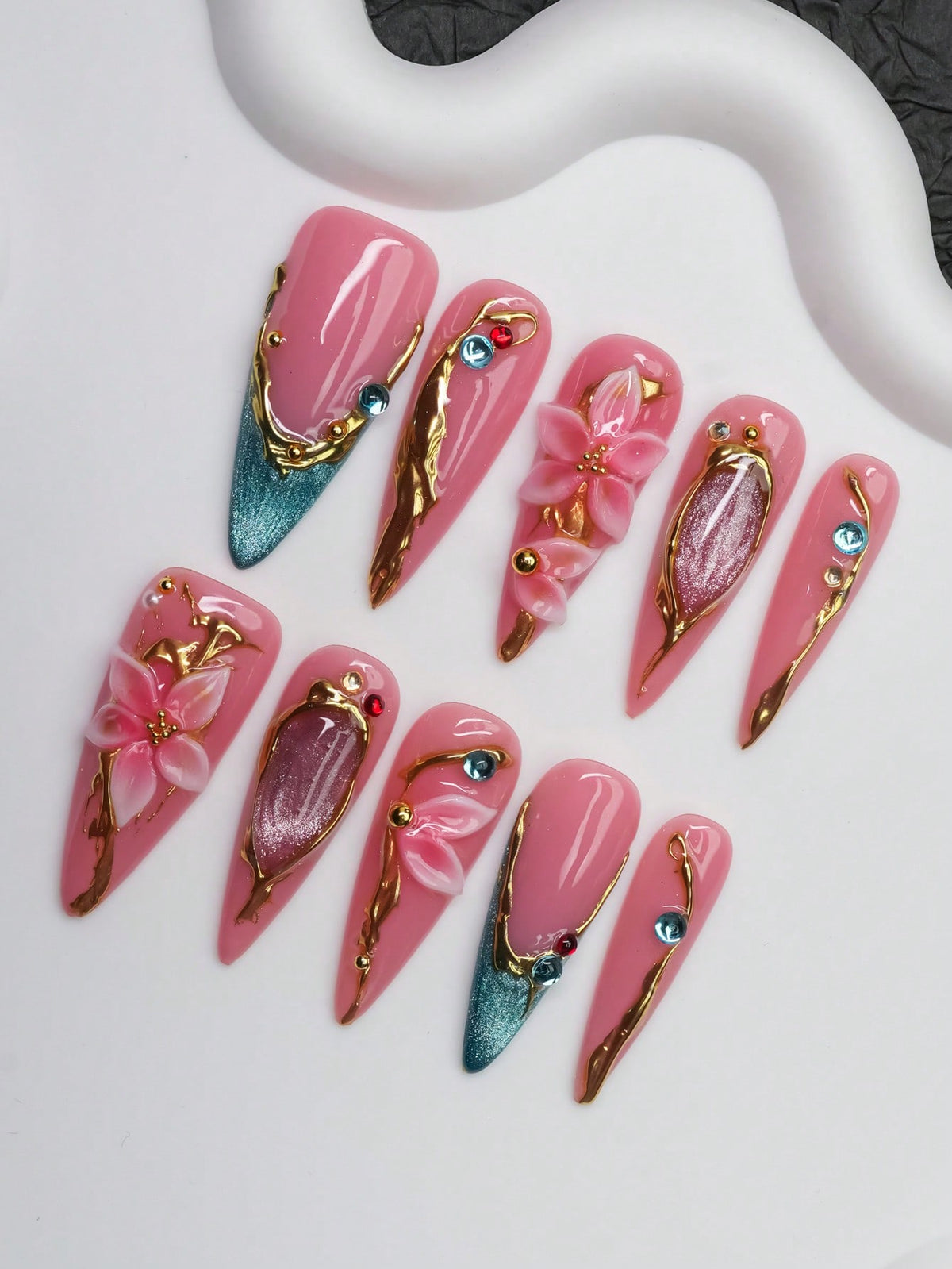 Gilded Lily long stiletto press on nails, pink gel with gold and teal cat-eye tips