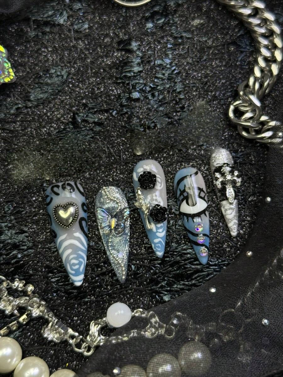 Frostbite Rose stiletto nails with heart charm and crystals