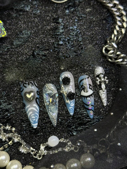 Frostbite Rose stiletto nails with heart charm and crystals
