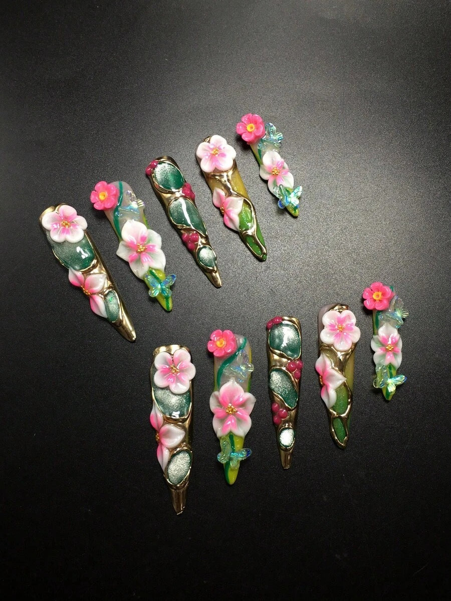 Peony Parlor stiletto nails fanned out on a dark backdrop