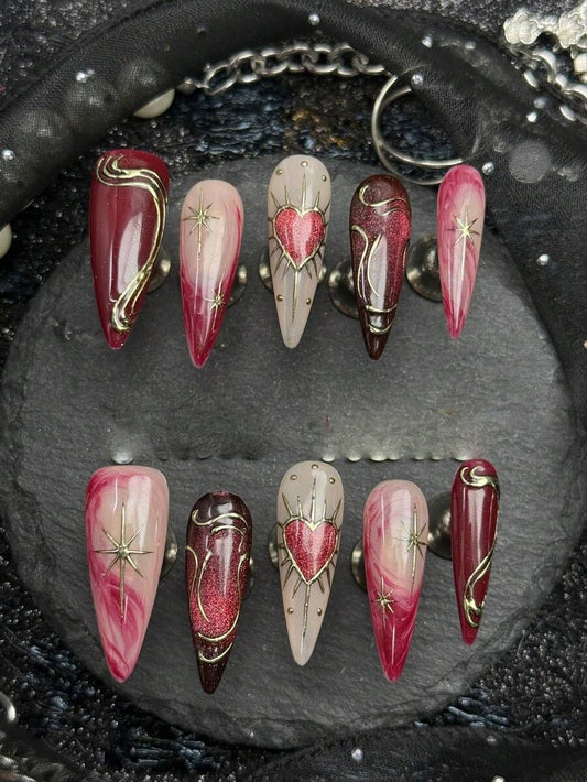 Bleeding Heart long stiletto press on nails in wine red and blush with gold heart linework